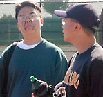 Lil' J intimidating the cameraman as sibling Tony Nguyen watches